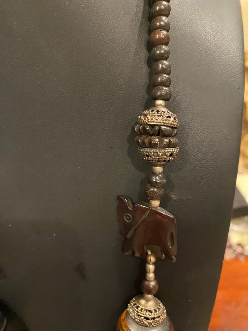 Handcrafted Elephant Pendant Necklace - Brown. Small elephants are bone.